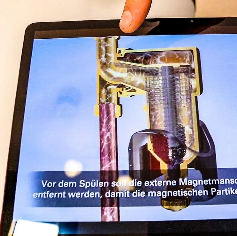 Funktionsgrafik: Die Magnetmanschette wird vor dem Spülen abgenommen